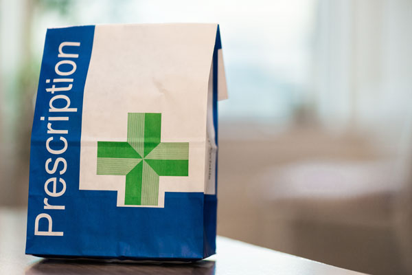 a paper bag with the word Prescription on it
