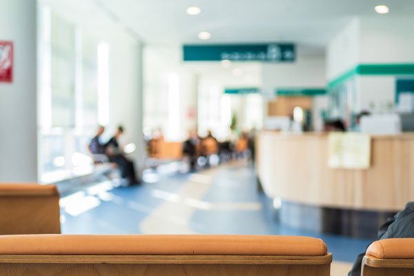 soft focus of patients waiting in a waiting room